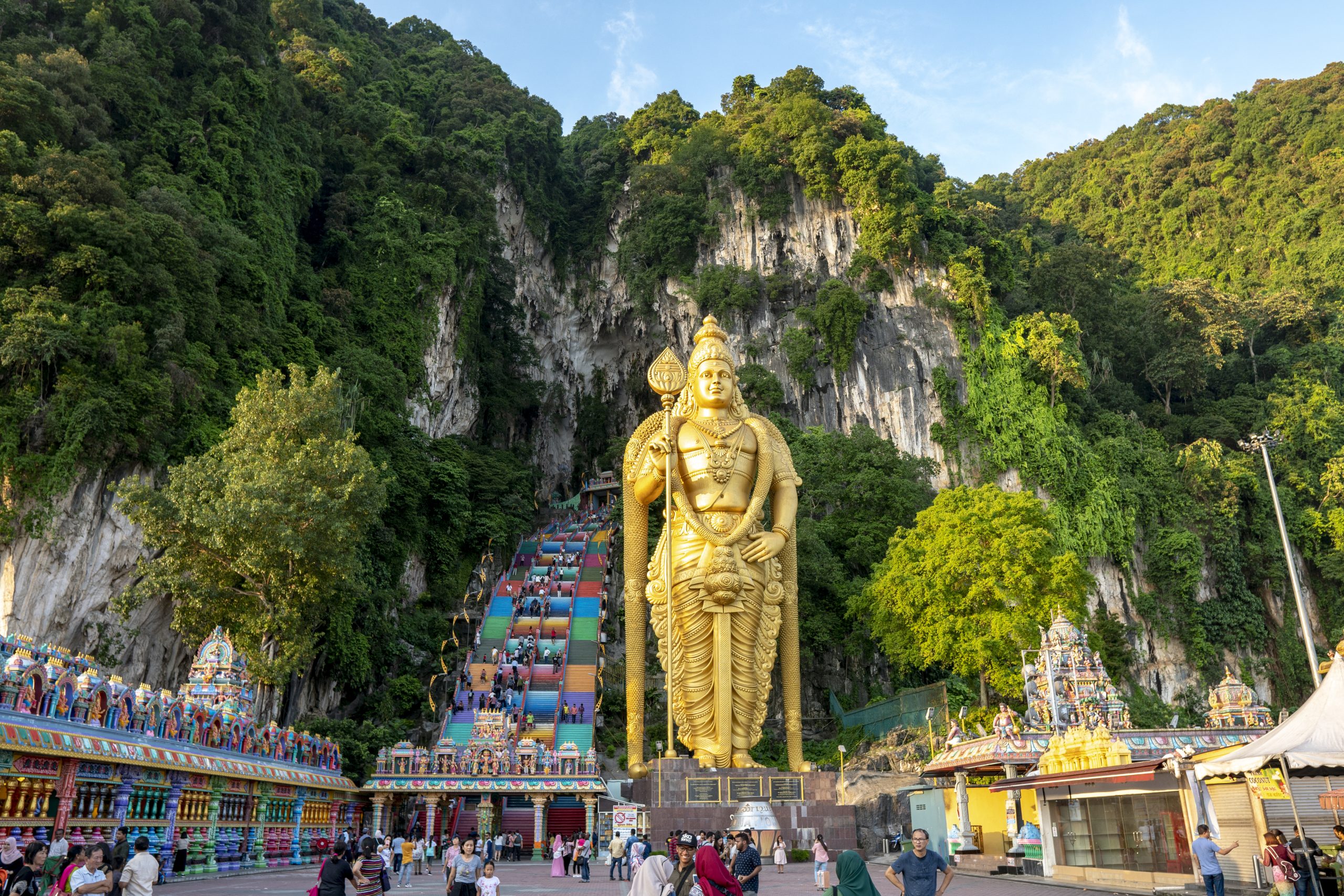 batu-caves-selangor-malaysia-may-1-2019-batu-caves-with-lord-murugan-statue-and-entrance-near-kuala-lumpur-malaysia-colorful-rainbow-stairs-at-batu-caves-entrance